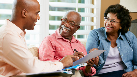 Advisor meets with couple in their home